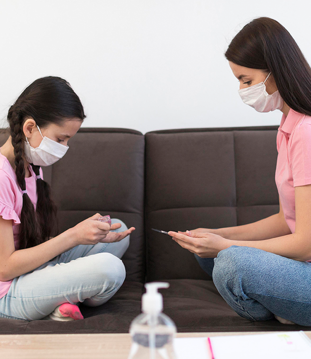 Doctor and child patient wearing masks during an allergy consultation